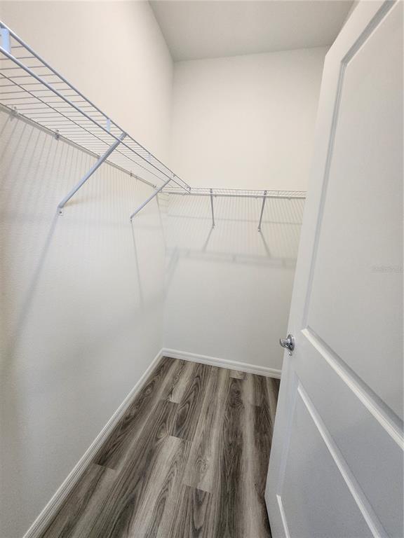 32760 Rustic Rise Road San Antonio, FL 33576 - Photo 19 of 27 a view of a room with racks on the wall