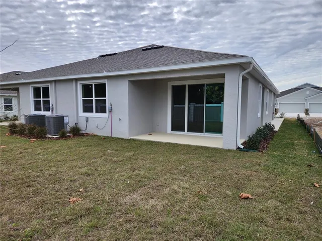 a house with trees in the background