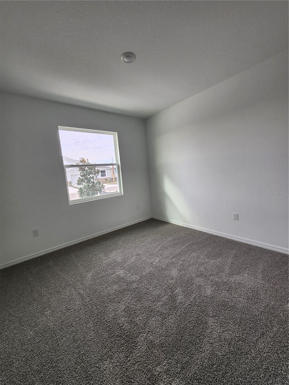 32760 Rustic Rise Road San Antonio, FL 33576 - Photo 21 of 27 an empty room with a window