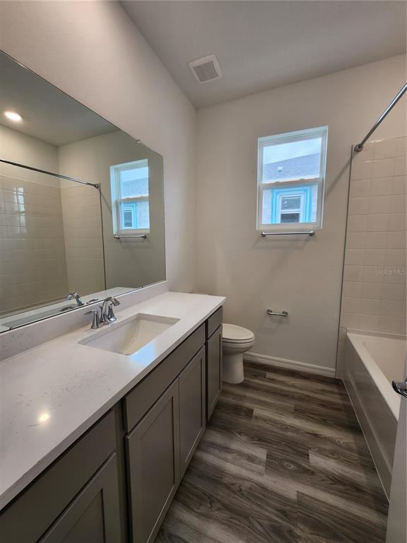 32760 Rustic Rise Road San Antonio, FL 33576 - Photo 22 of 27 a bathroom with a sink and a mirror
