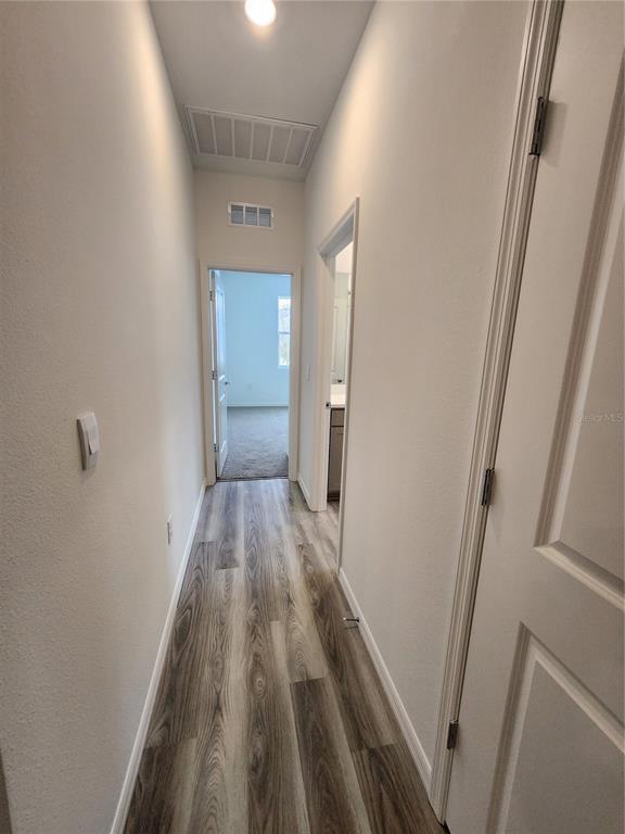32760 Rustic Rise Road San Antonio, FL 33576 - Photo 23 of 27 a view of hallway with wooden floor