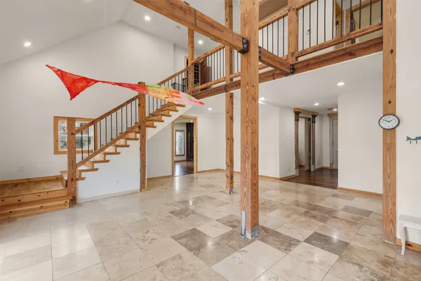 a kitchen with stainless steel appliances granite countertop a sink and a refrigerator