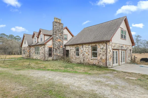 a view of hallway with wooden floor
