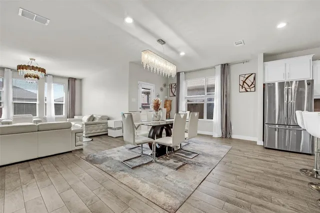 a view of a living room and dining room