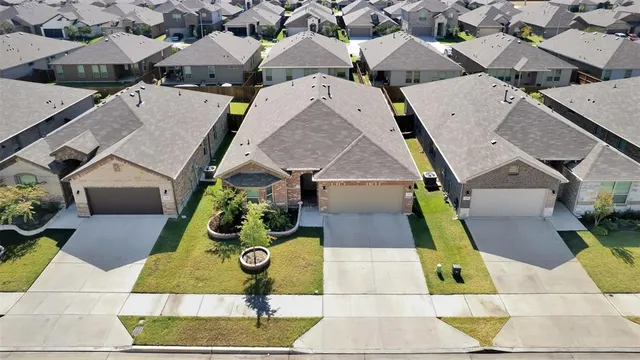 an aerial view of a house with swimming pool