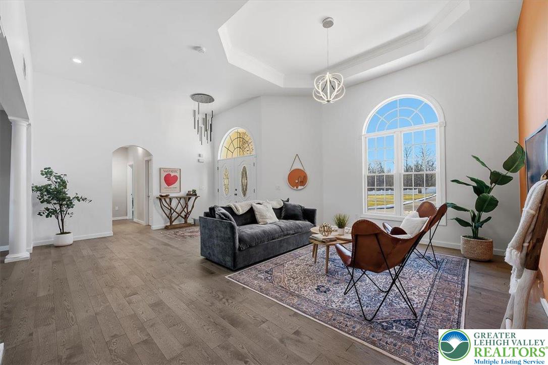 901 Meyer Road Nazareth, PA 18064 - Photo 18 of 80 a living room with furniture a rug and a large window