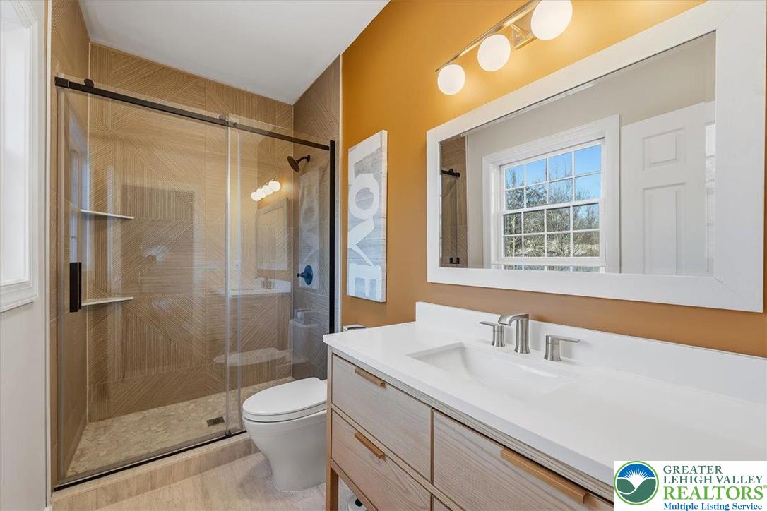 901 Meyer Road Nazareth, PA 18064 - Photo 31 of 80 a bathroom with a sink a toilet and shower