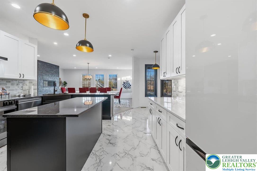 901 Meyer Road Nazareth, PA 18064 - Photo 34 of 80 a kitchen with stainless steel appliances granite countertop a sink and cabinets