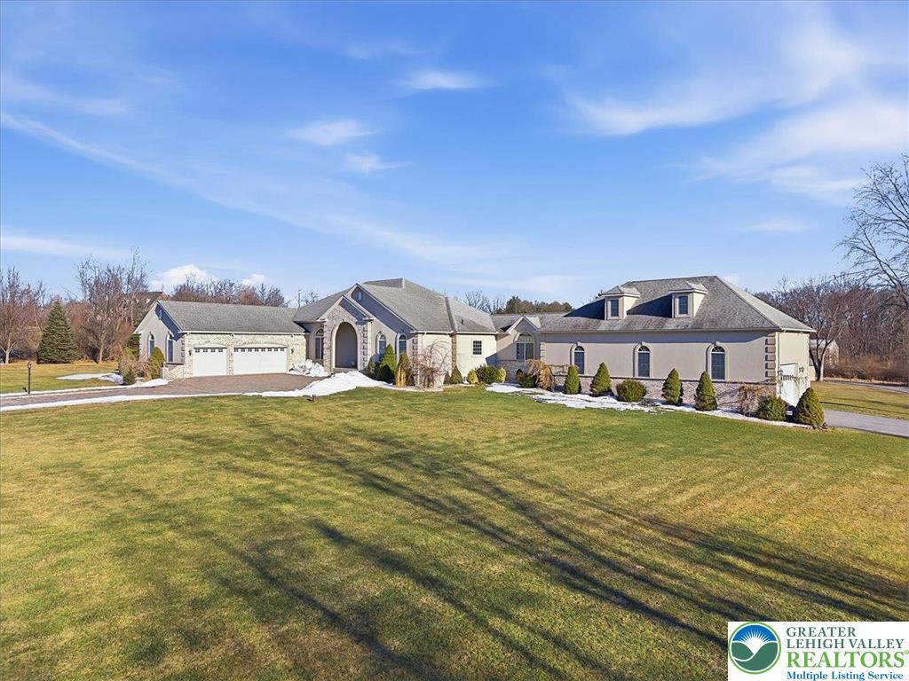 901 Meyer Road Nazareth, PA 18064 - Photo 4 of 80 a front view of a house with a yard