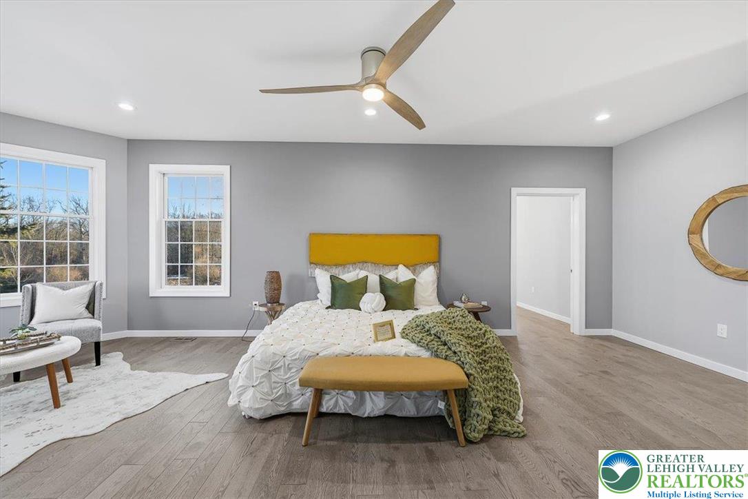 901 Meyer Road Nazareth, PA 18064 - Photo 45 of 80 a bedroom with a bed and wooden floor