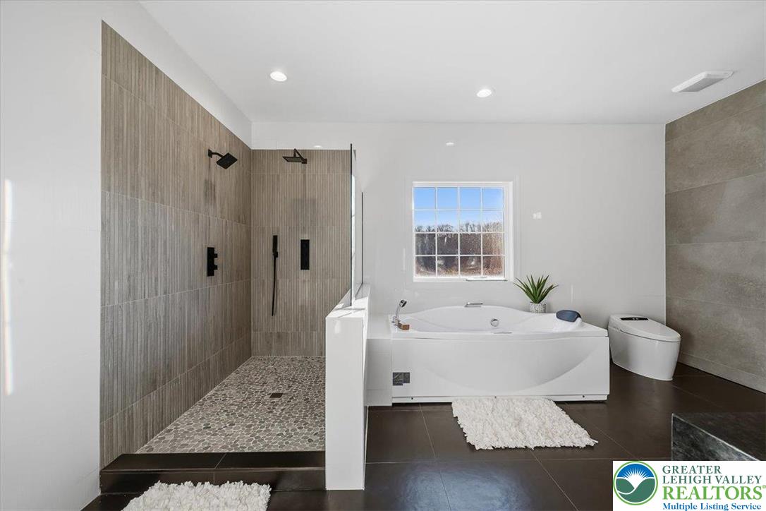 901 Meyer Road Nazareth, PA 18064 - Photo 47 of 80 a spacious bathroom with a bathtub and a sink