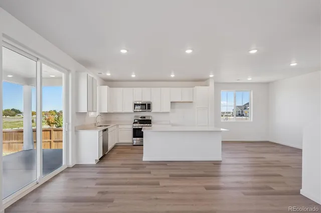 a view of kitchen with wooden floor