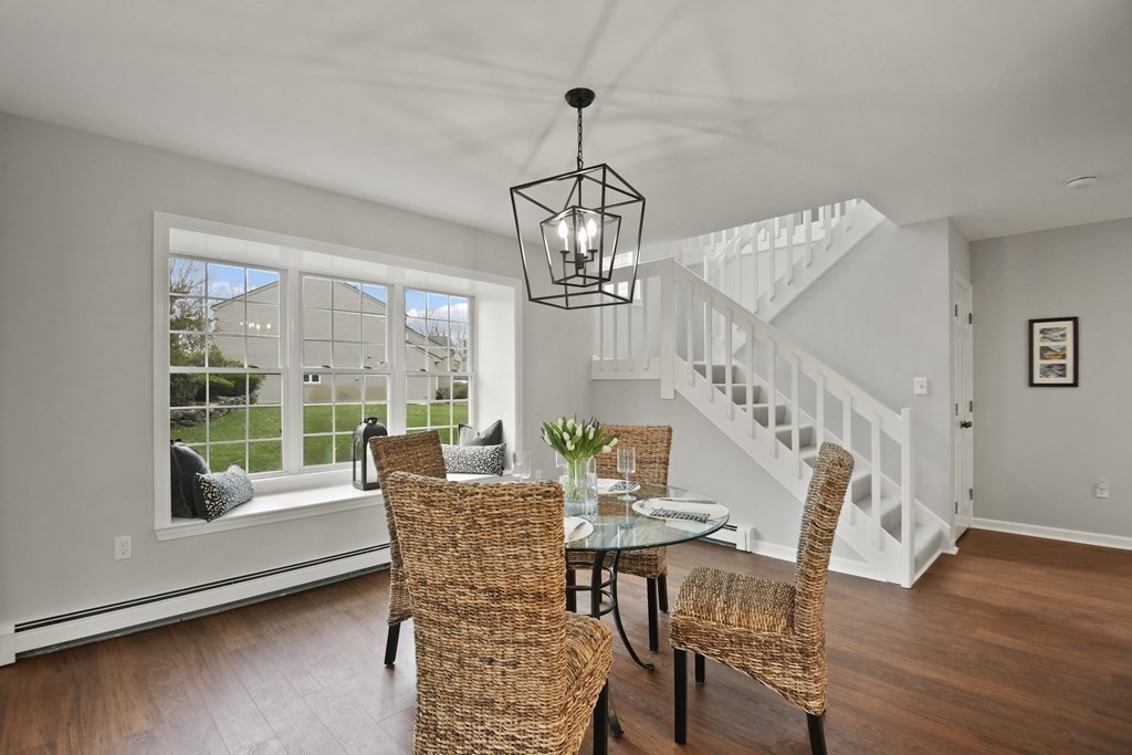 307 Ridgefield Circle, Unit D Clinton, MA 01510 - Photo 12 of 42 a view of a dining room with furniture window and wooden floor