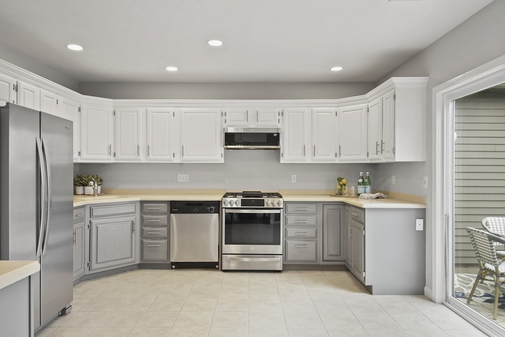 307 Ridgefield Circle, Unit D Clinton, MA 01510 - Photo 16 of 42 a kitchen with a sink a stove and refrigerator
