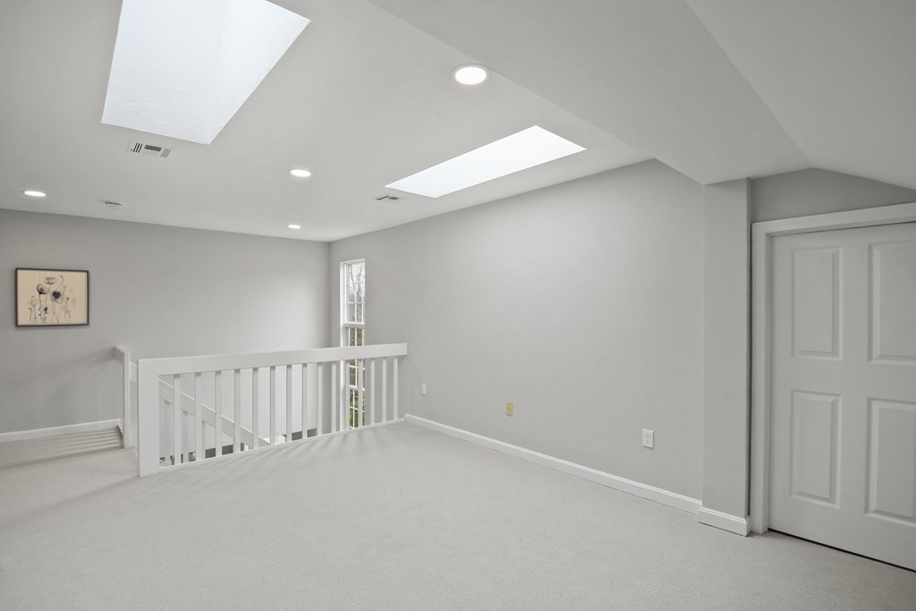307 Ridgefield Circle, Unit D Clinton, MA 01510 - Photo 24 of 42 en empty room with windows
