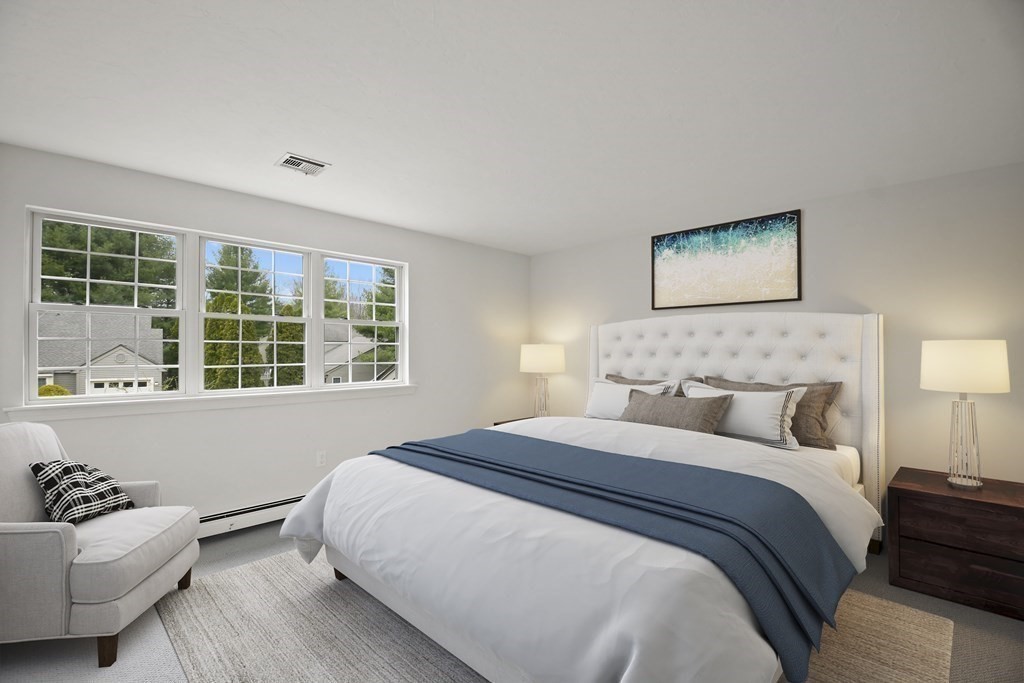 307 Ridgefield Circle, Unit D Clinton, MA 01510 - Photo 25 of 42 a bedroom with a bed and windows