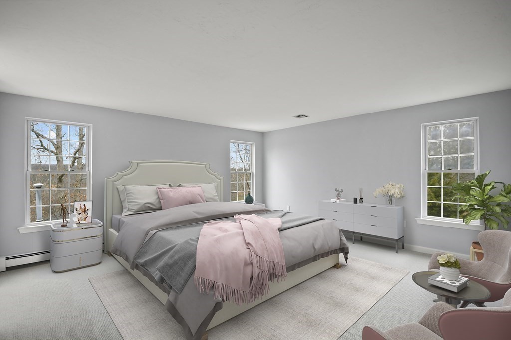 307 Ridgefield Circle, Unit D Clinton, MA 01510 - Photo 28 of 42 a bedroom with a bed and wooden floor