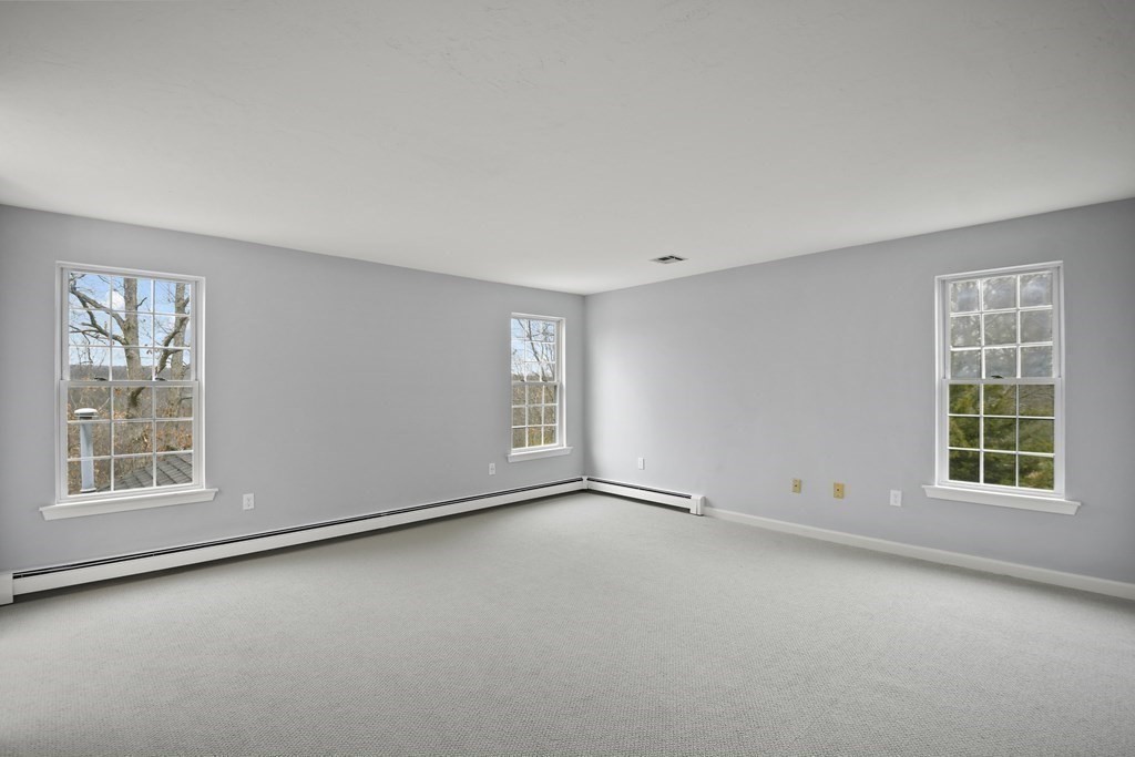 307 Ridgefield Circle, Unit D Clinton, MA 01510 - Photo 29 of 42 an empty room with windows