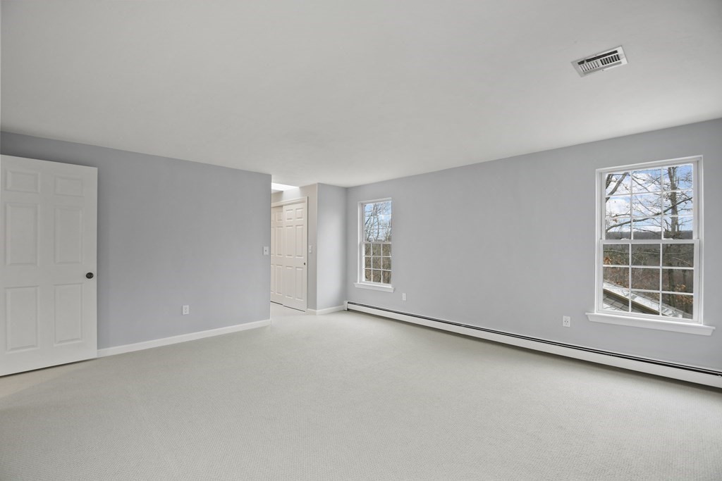 307 Ridgefield Circle, Unit D Clinton, MA 01510 - Photo 30 of 42 a view of an empty room with a window