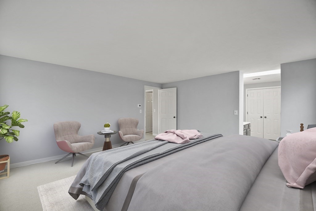 307 Ridgefield Circle, Unit D Clinton, MA 01510 - Photo 31 of 42 a bedroom with two beds and a potted plant