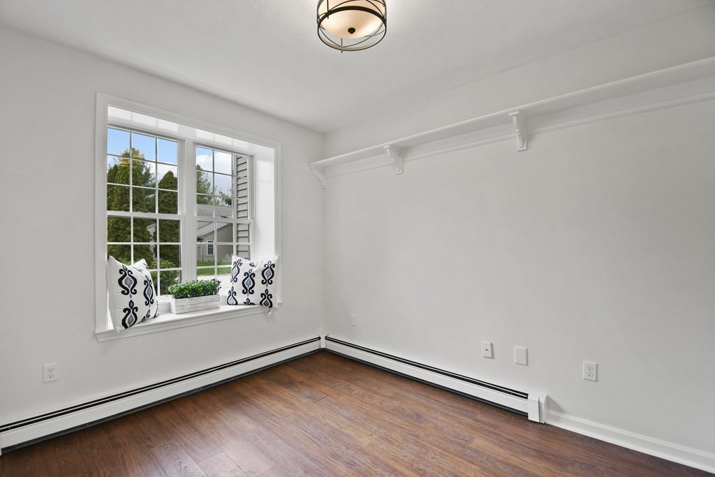 307 Ridgefield Circle, Unit D Clinton, MA 01510 - Photo 5 of 42 a view of a room with wooden floor and window