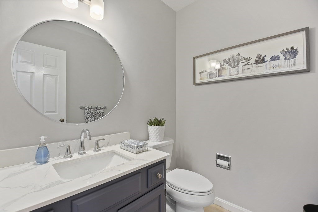 307 Ridgefield Circle, Unit D Clinton, MA 01510 - Photo 6 of 42 a bathroom with a granite countertop sink mirror and toilet