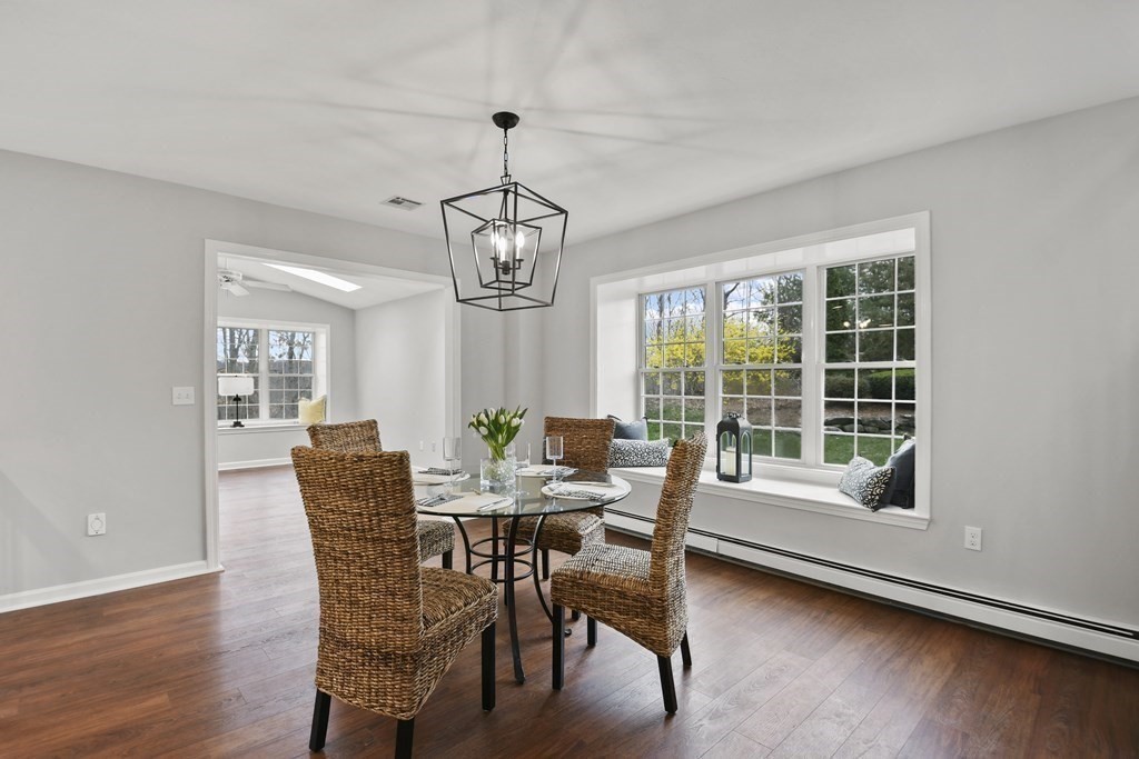 307 Ridgefield Circle, Unit D Clinton, MA 01510 - Photo 8 of 42 a view of a dining room with furniture window and wooden floor