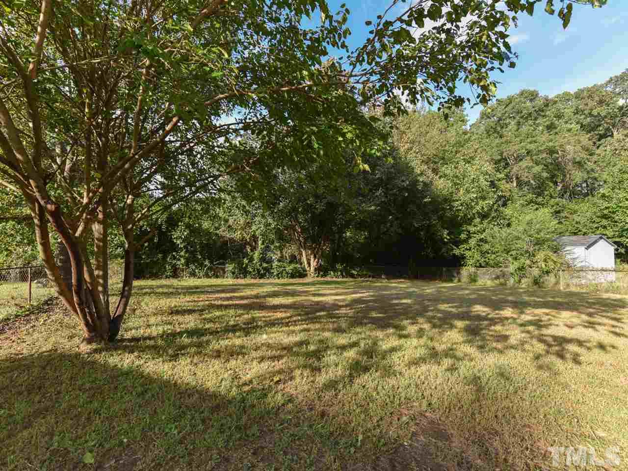 1221 Seabrook Road Raleigh, NC 27610 - Photo 15 of 16 a view of a yard with a tree
