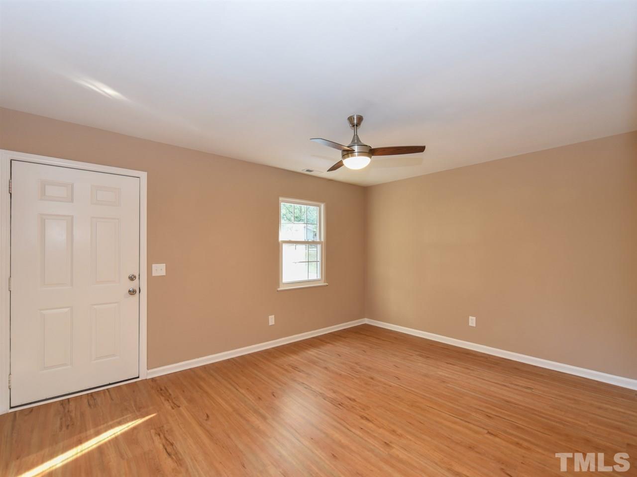 1221 Seabrook Road Raleigh, NC 27610 - Photo 6 of 16 a view of empty room with wooden floor