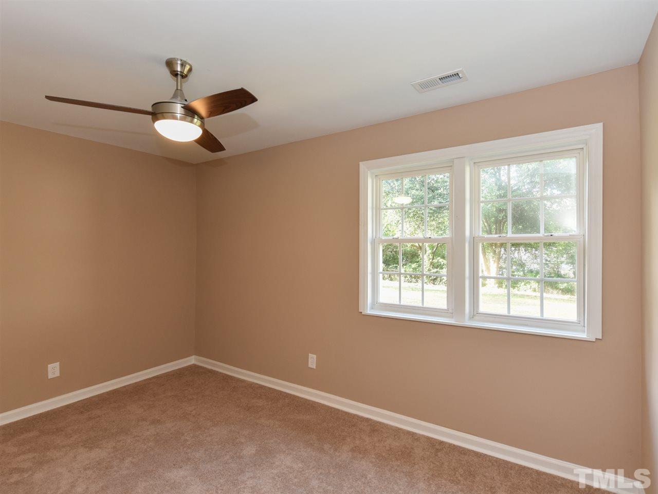 1221 Seabrook Road Raleigh, NC 27610 - Photo 8 of 16 a view of an empty room with a window