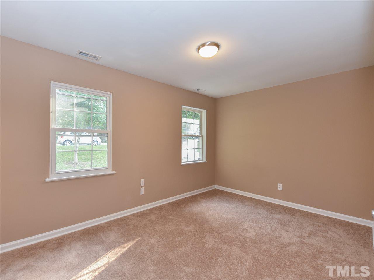 1221 Seabrook Road Raleigh, NC 27610 - Photo 10 of 16 an empty room with windows