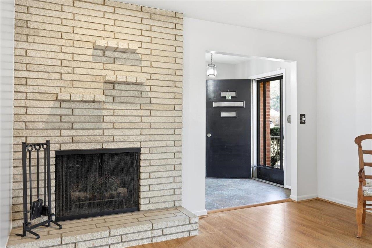 1133 Club Road Waynesboro, VA 22980 - Photo 11 of 58 a view of an empty room with wooden floor and a fireplace