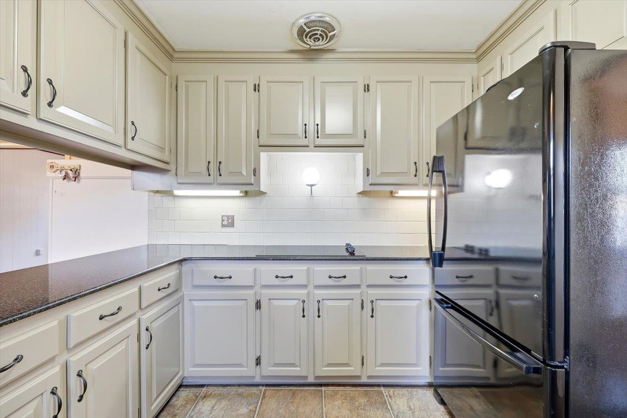 1133 Club Road Waynesboro, VA 22980 - Photo 14 of 58 a kitchen with white cabinets and refrigerator