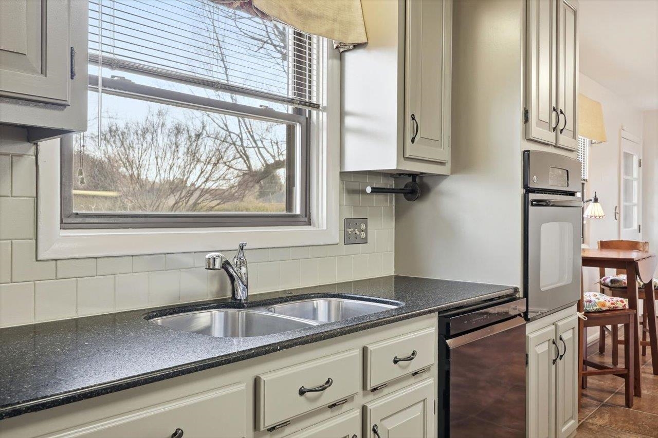 1133 Club Road Waynesboro, VA 22980 - Photo 18 of 58 a kitchen with stainless steel appliances granite countertop a sink and a window