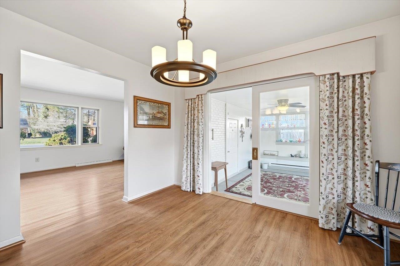 1133 Club Road Waynesboro, VA 22980 - Photo 23 of 58 a view of an empty room with wooden floor and a window