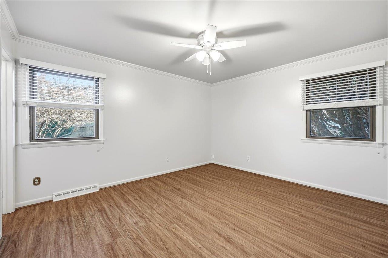 1133 Club Road Waynesboro, VA 22980 - Photo 32 of 58 a view of an empty room with wooden floor and a window