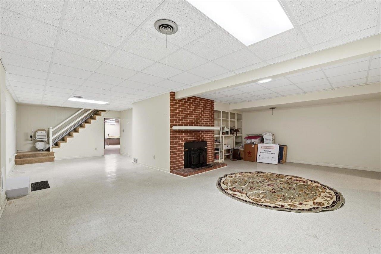 1133 Club Road Waynesboro, VA 22980 - Photo 43 of 58 an empty room with furniture and fireplace