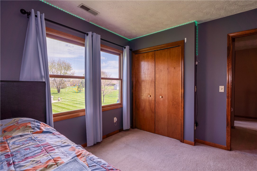 3628 Petre Road Springfield, OH 45502 - Photo 23 of 52 This cozy bedroom features ample natural light and plush carpeting, perfect for relaxation.