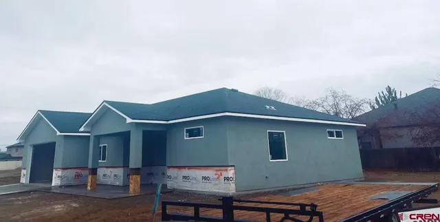 a backyard of a house with seating space