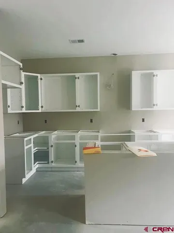 a utility room with cabinets