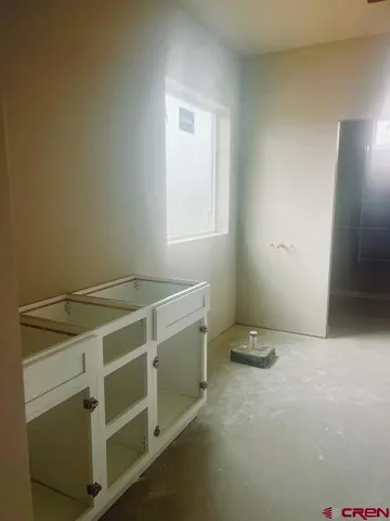 a view of storage and utility room with washer and dryer