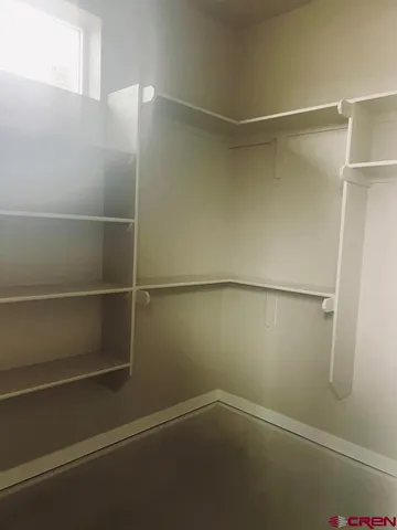 a view of an empty walk in closet