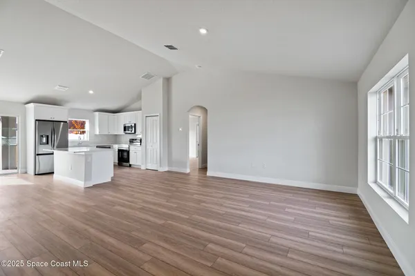 a view of kitchen with wooden floor