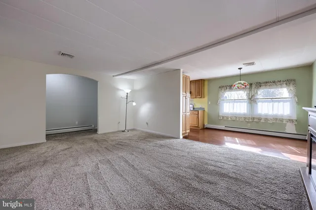a view of a chair and tables on the deck