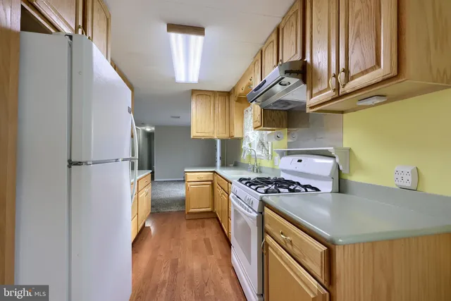 a kitchen with a stove and a refrigerator