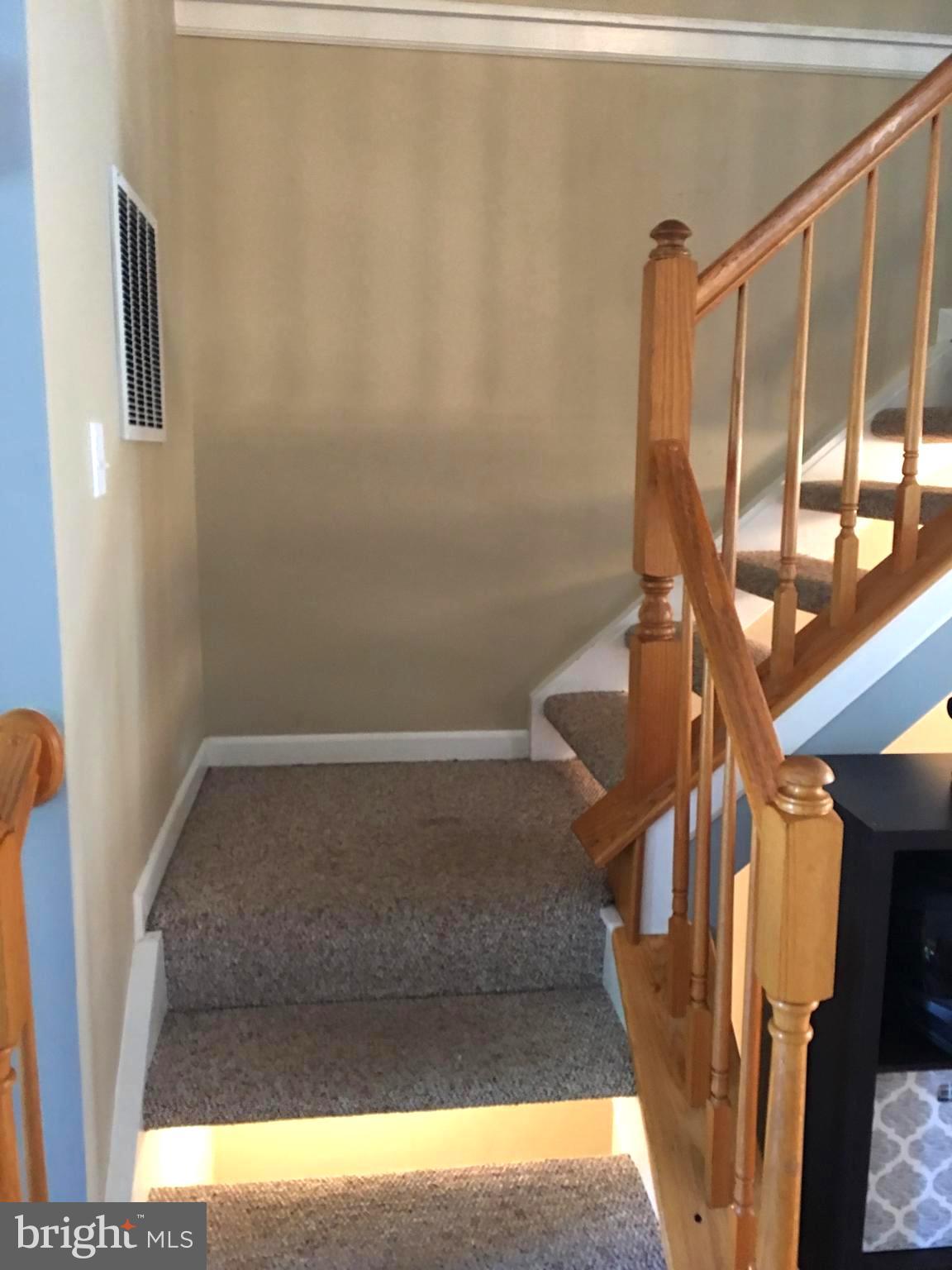 43506 Postrail Square Ashburn, VA 20147 - Photo 23 of 59 Carpeted stairs leading to the upstairs