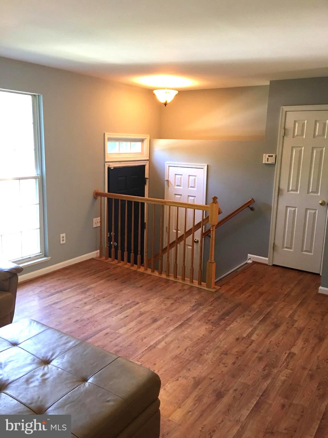 43506 Postrail Square Ashburn, VA 20147 - Photo 4 of 59 Foyer leads to large living room