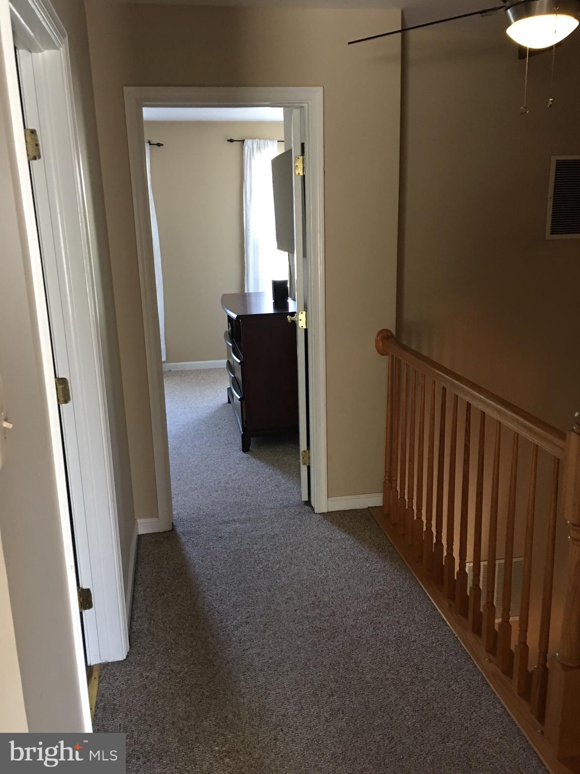 43506 Postrail Square Ashburn, VA 20147 - Photo 38 of 59 Upstairs hallway with oak bannister