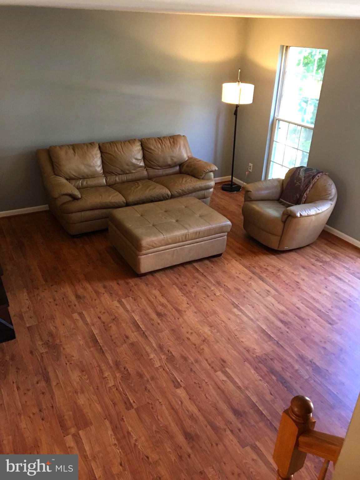 43506 Postrail Square Ashburn, VA 20147 - Photo 5 of 59 Living room has large floor to ceiling windows