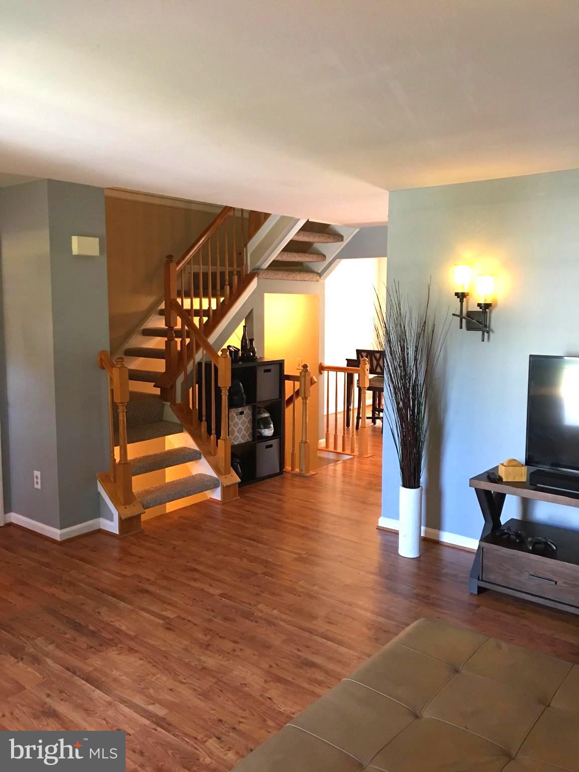 43506 Postrail Square Ashburn, VA 20147 - Photo 7 of 59 Living room flows to dining area